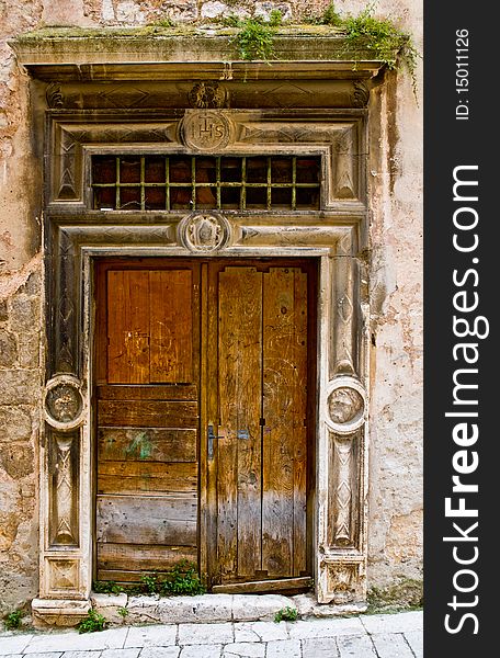 Old broken wooden door with religious symbols. Old broken wooden door with religious symbols