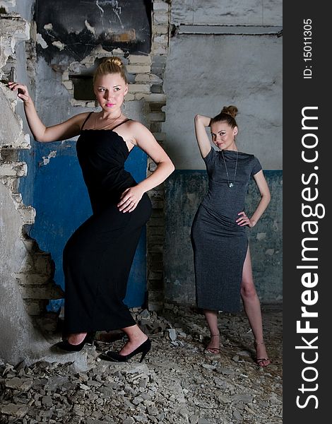 Beautiful young women posing in the ruins