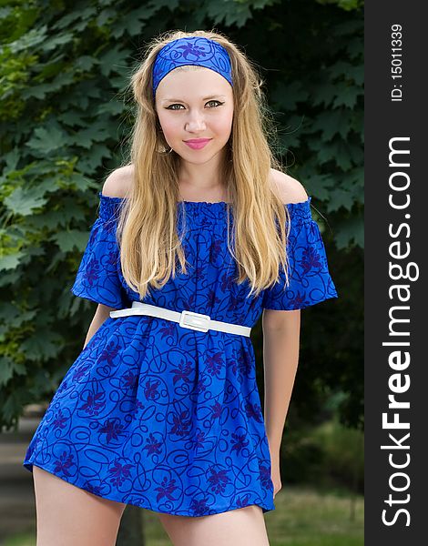 Pretty Young Woman In Blue Dress Posing