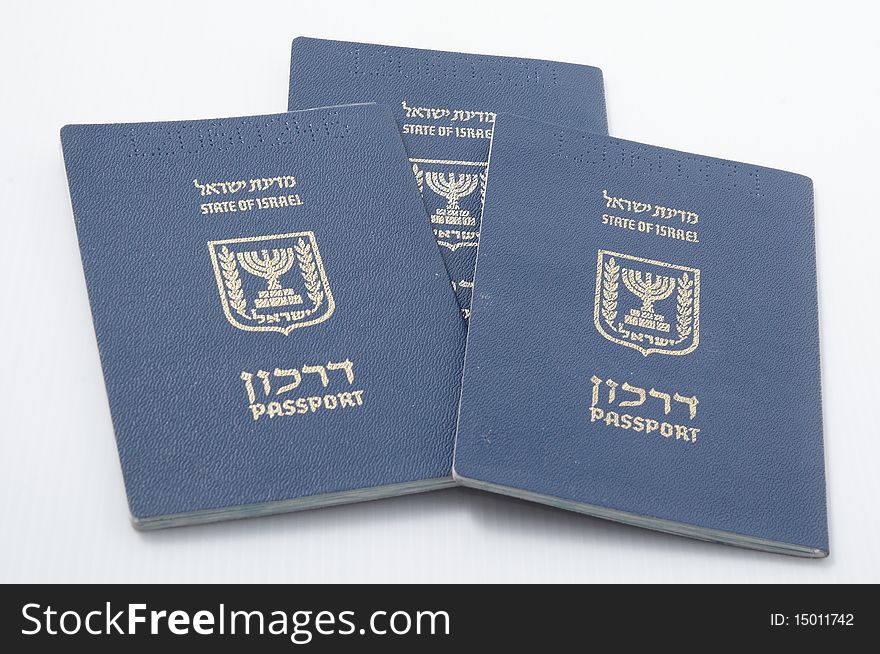 Three Israeli passport isolated on a white background. Three Israeli passport isolated on a white background.