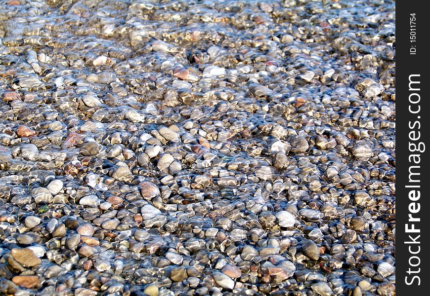 Pebble under storm water are very smooth. Pebble under storm water are very smooth