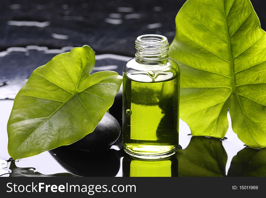 Aromatherapy bottle of essential aroma liquid and leaf. Aromatherapy bottle of essential aroma liquid and leaf