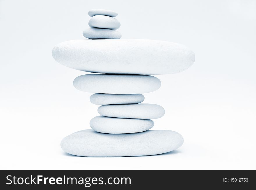 Stack of smooth stones over white background. Stack of smooth stones over white background