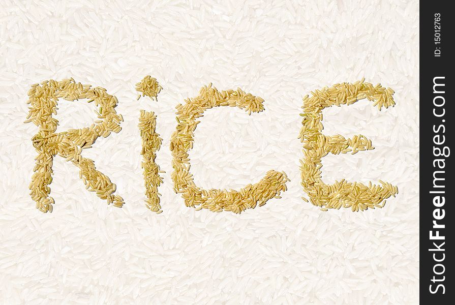 Long grain rice in letter shapes over faded rice background