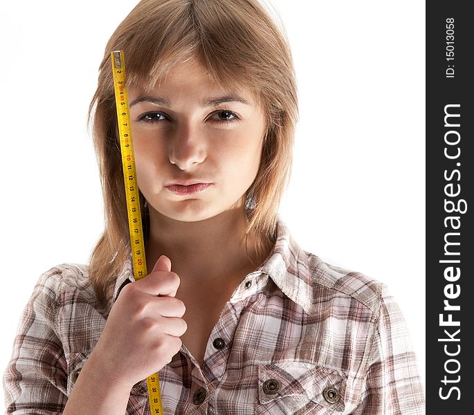 Portrait of the girl with tape measure on white background