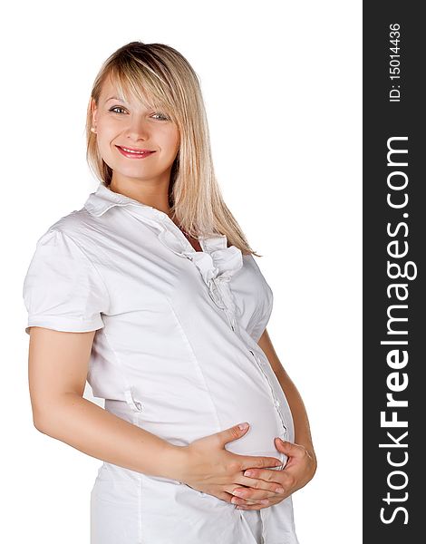 Pregnant pretty woman in studio over white background