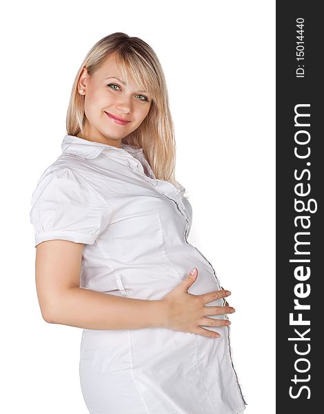 Pregnant pretty woman in studio over white background