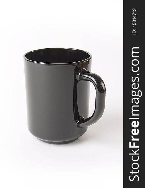 Black ceramic cup of coffee and tea over white background