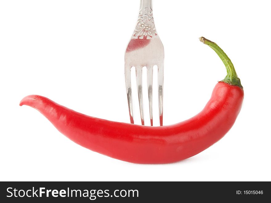 Chili pepper on fork isolatated background