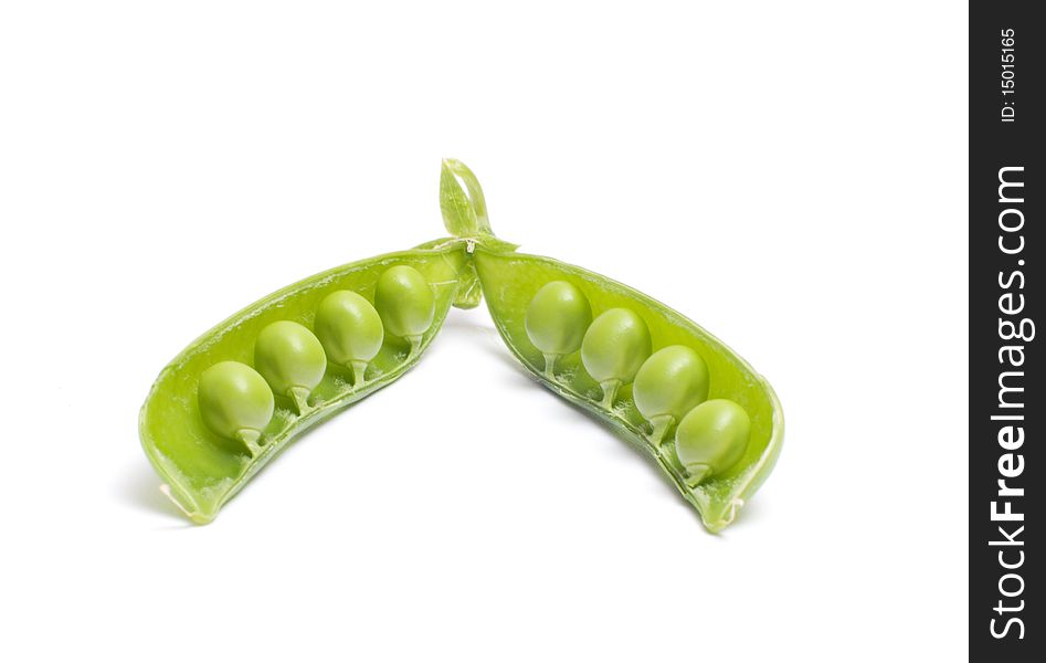 Open pod of peas it is isolated on a white background. Open pod of peas it is isolated on a white background.