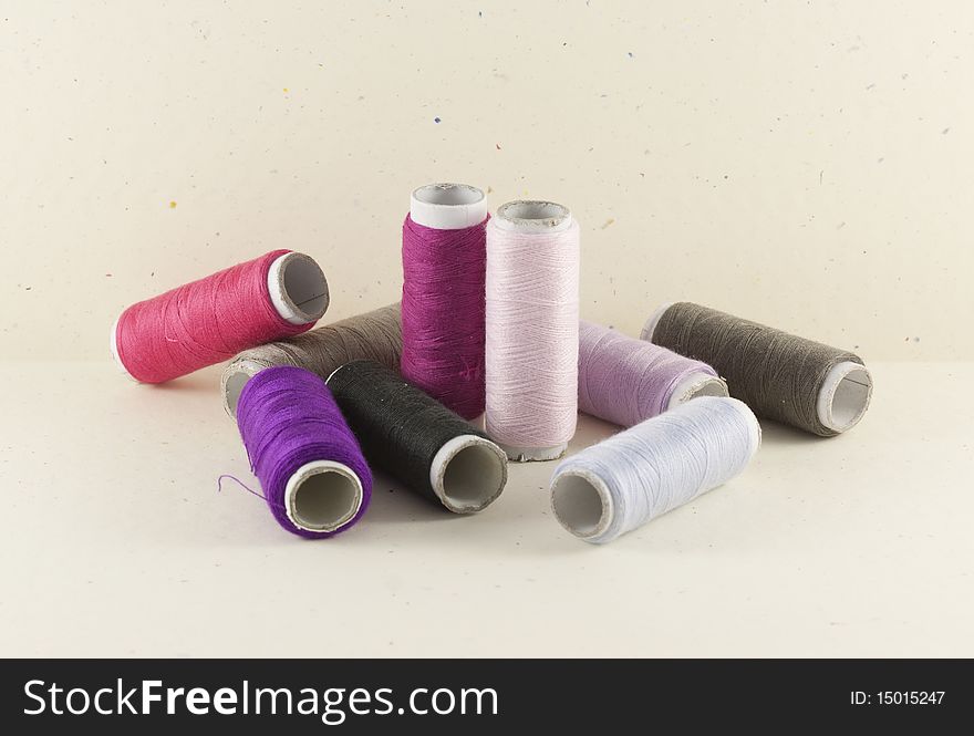 Pink color threads on spotted background