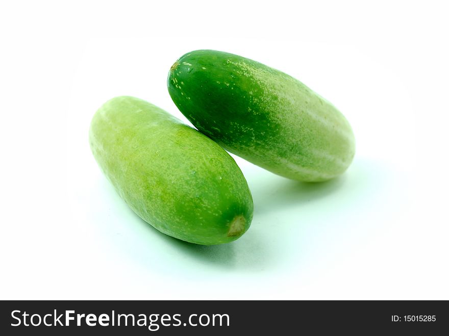 Fresh cucumbers, green on white background