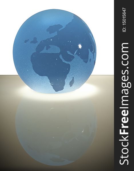 This image shows a glass sphere with a map you see Europe and Africa. This image shows a glass sphere with a map you see Europe and Africa