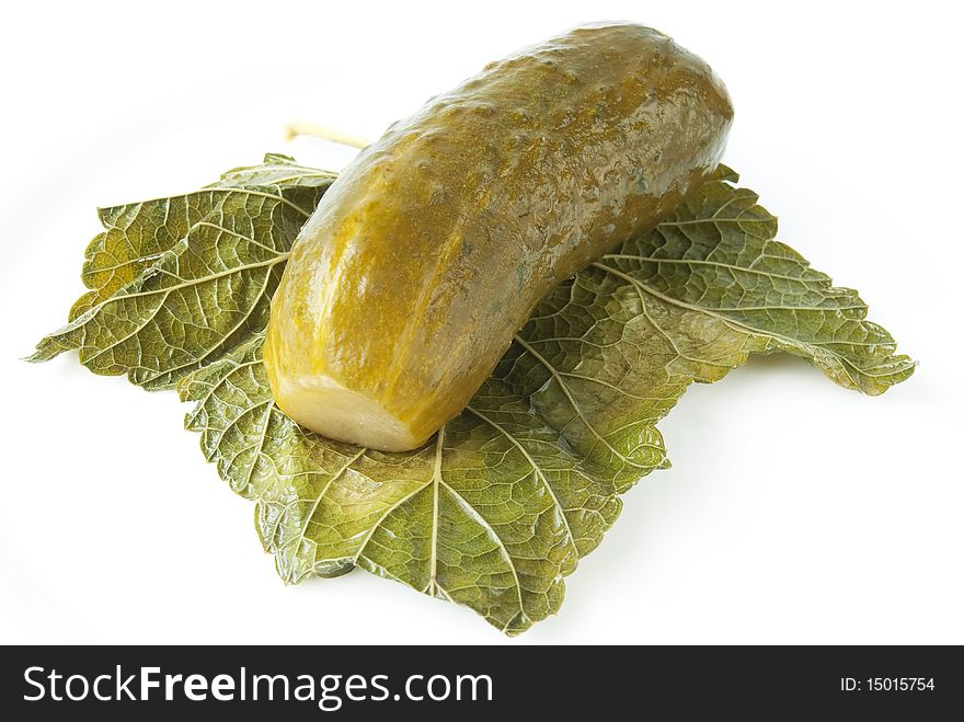 Juicy pickled cucumber with leaf isolated