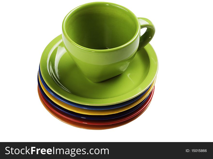 Green tea cup and set of multi-coloured saucers isolated on a white background. Green tea cup and set of multi-coloured saucers isolated on a white background