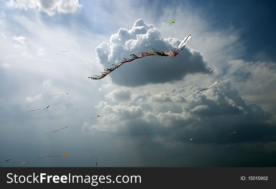 Color kites in cloud sky