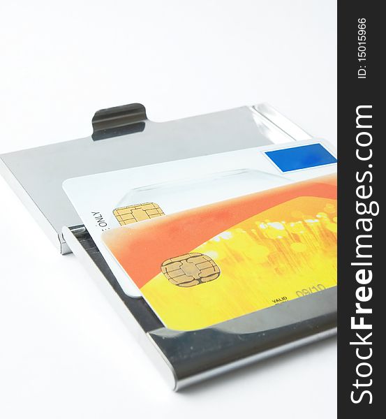 Credit card with metallic case over white