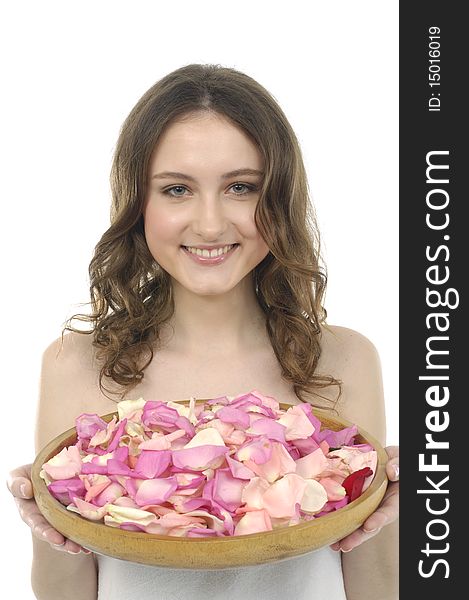 Model holding bowl of rose petals. Model holding bowl of rose petals