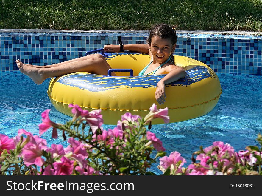 Girl enjoying floating on the lazy river. Girl enjoying floating on the lazy river.