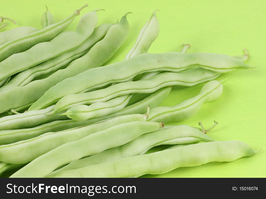 Green beans isolated on green background