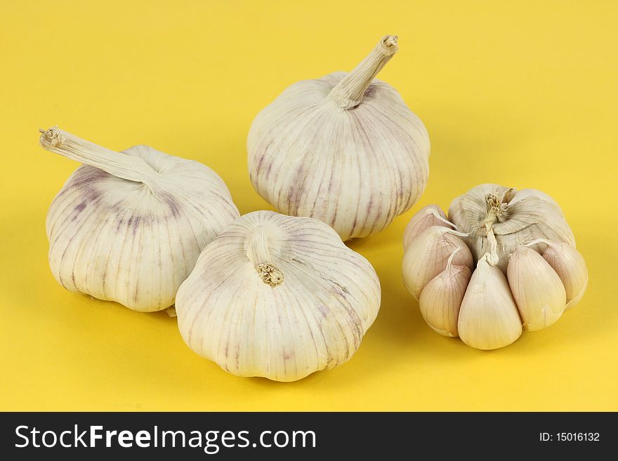 The garlic on yellow background