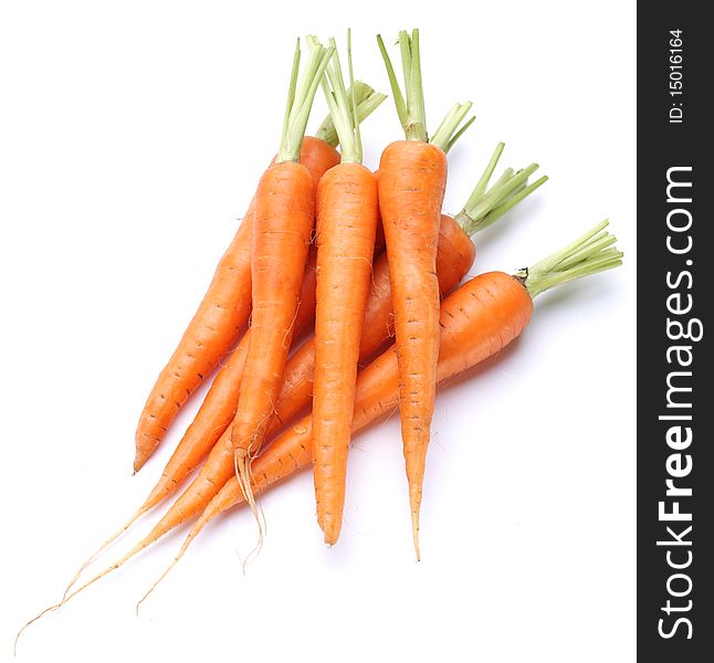 Ripe fresh carrots on a white background.