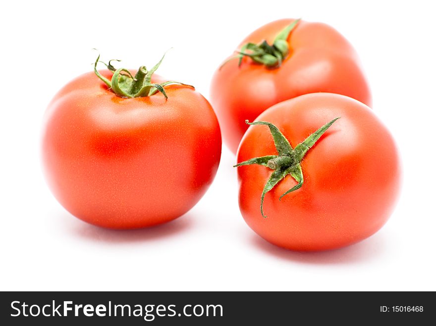 Fresh tomatoes isolated on a white background.