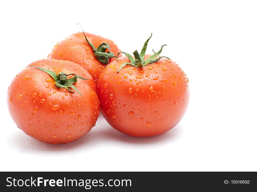 Fresh tomatoes  isolated on a white background.