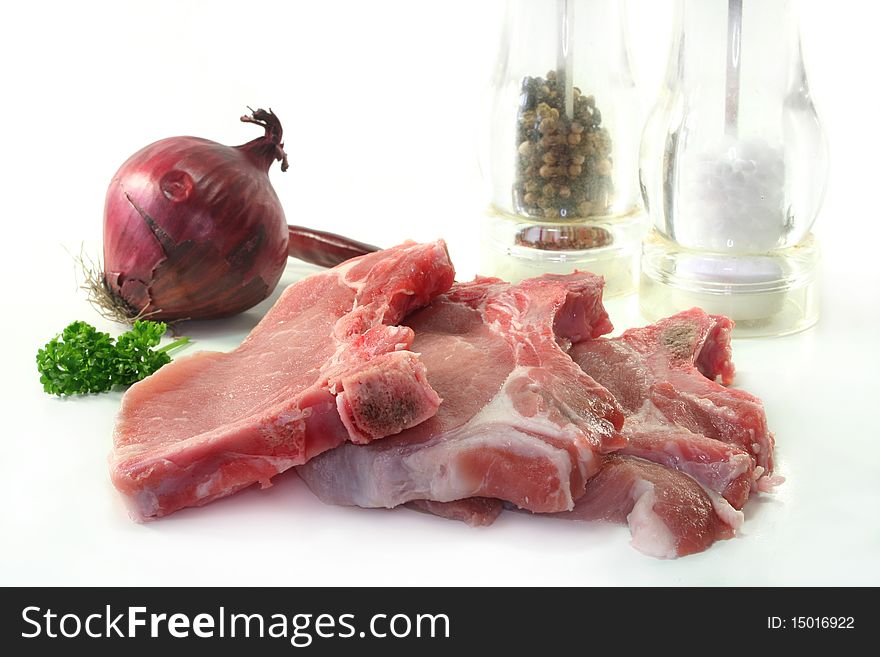 Raw chops on a white background