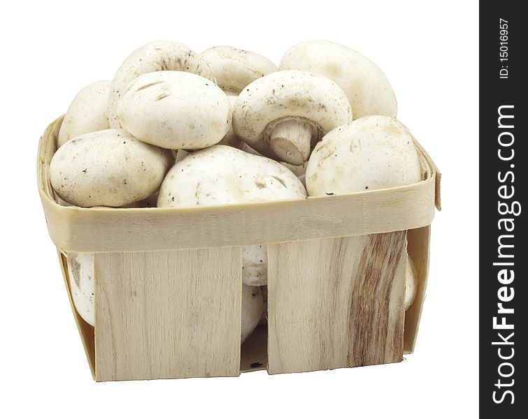 Mushrooms in a wooden box on a white background