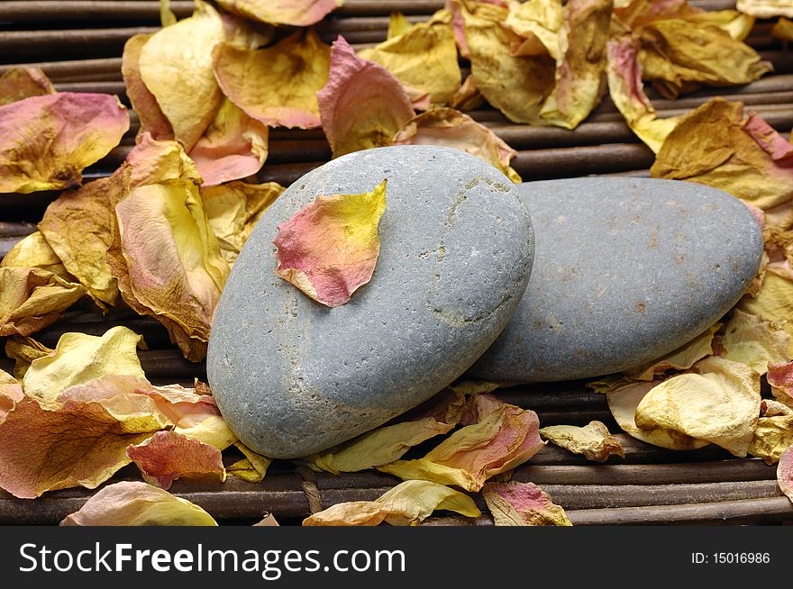 Rose withered petals spa with stone. Rose withered petals spa with stone