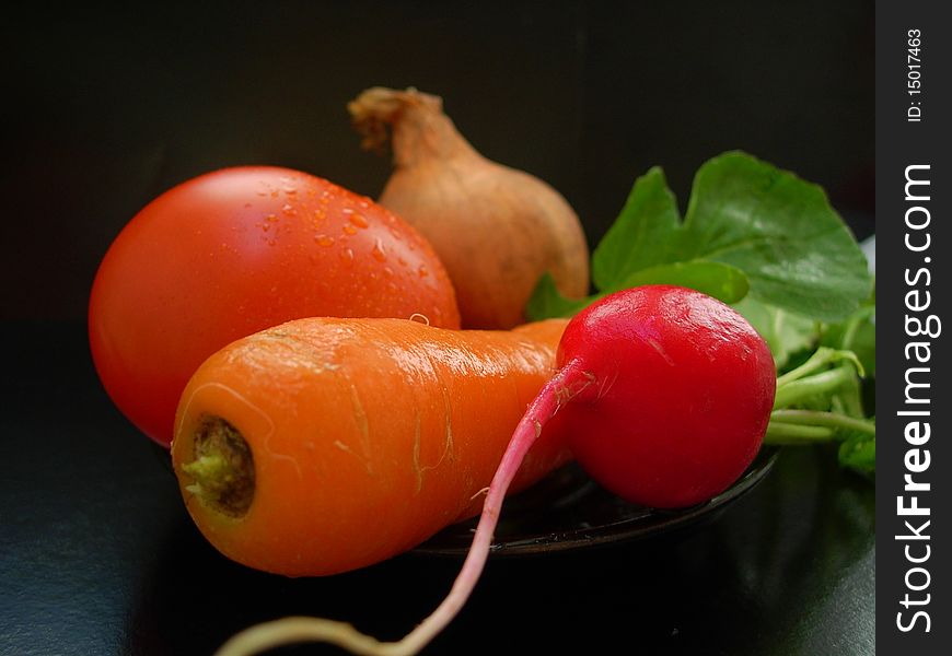 The colorful vegetables on a black background