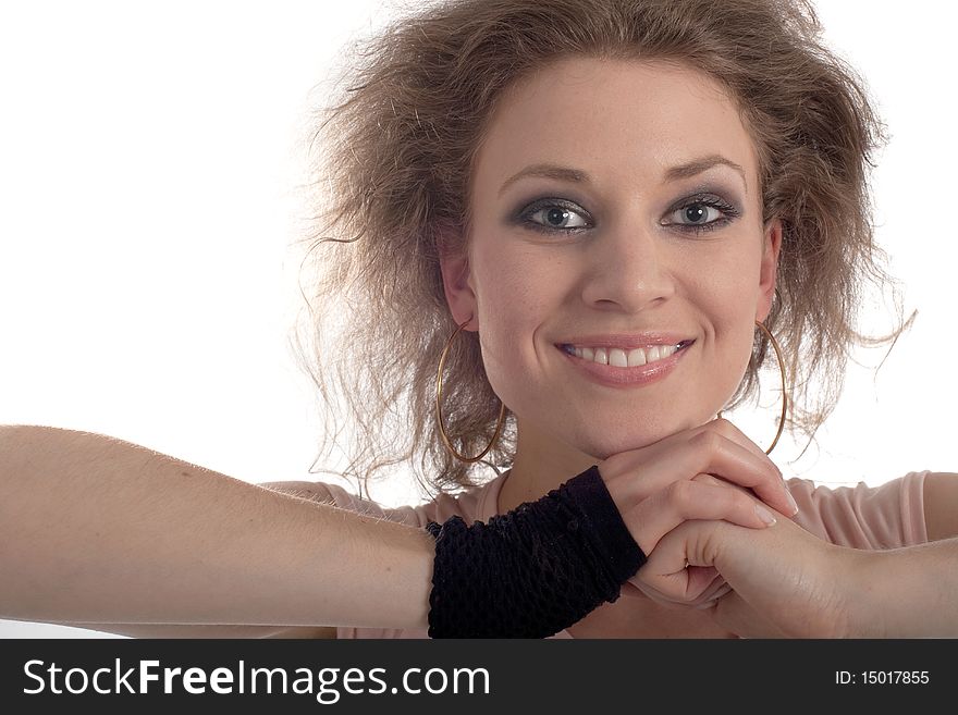 Young fashion model with her hands at her head. Isolated over white.