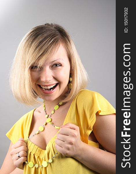 Smiling girl in yellow shirt