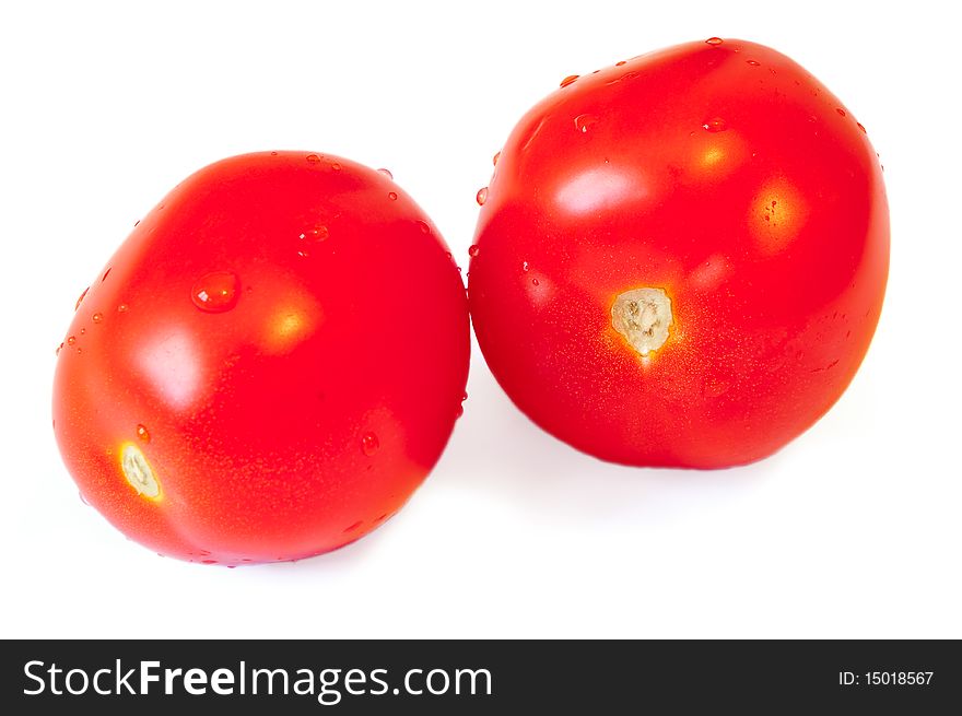 Two red tomatoes with a shade on a white background. Two red tomatoes with a shade on a white background