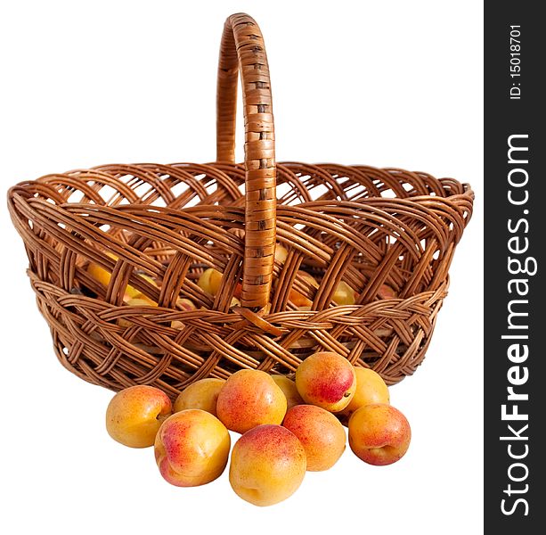 Apricots in a basket on a white background