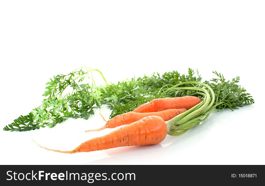 Carrots with the leaves on a white background