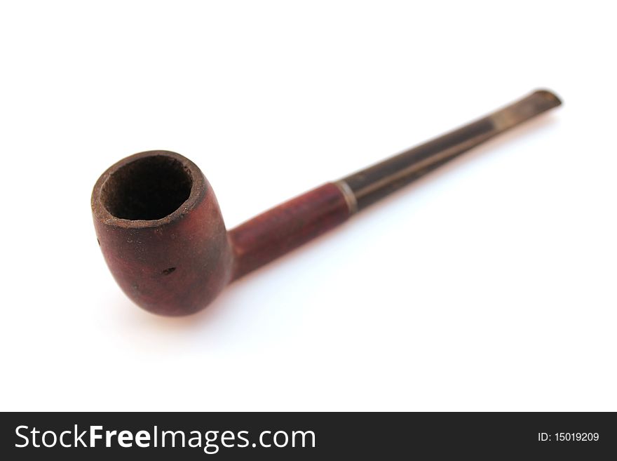 Old wood tobacco pipe isolated on white background