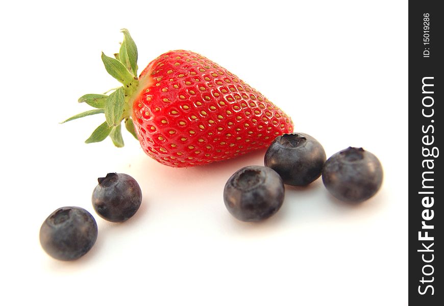 Strawberry and blueberries isolated over white background