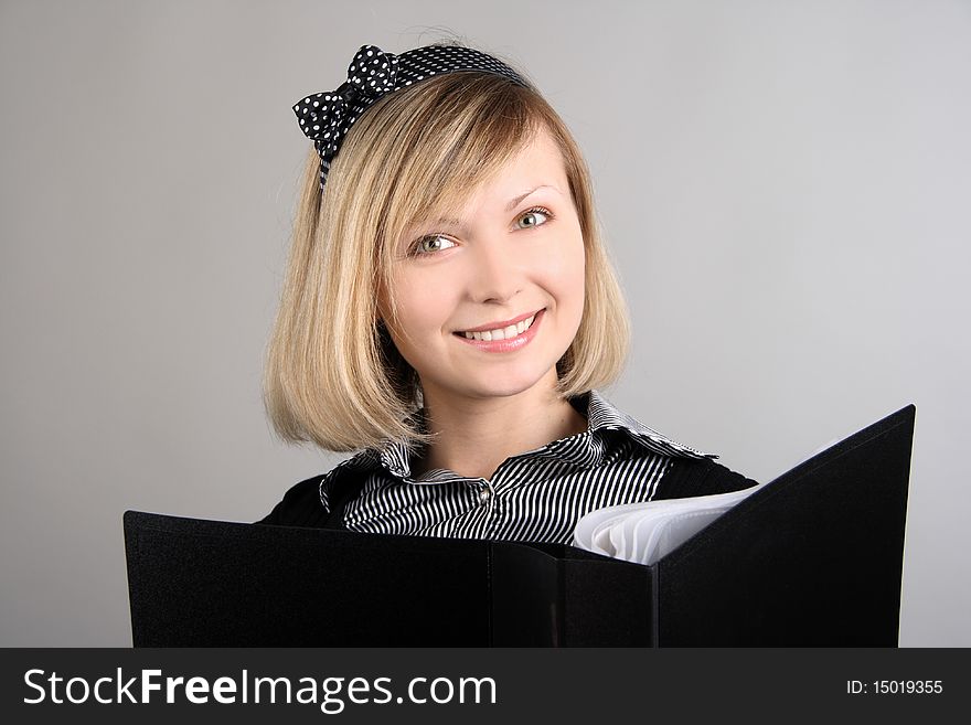 Portrait of business girl with papers in studio over white