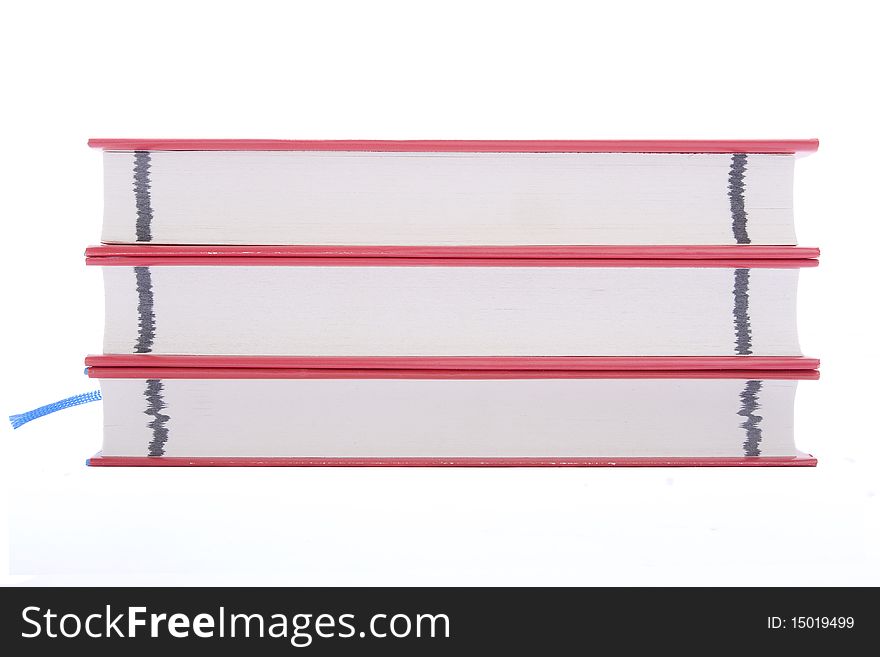 Three red books against white background