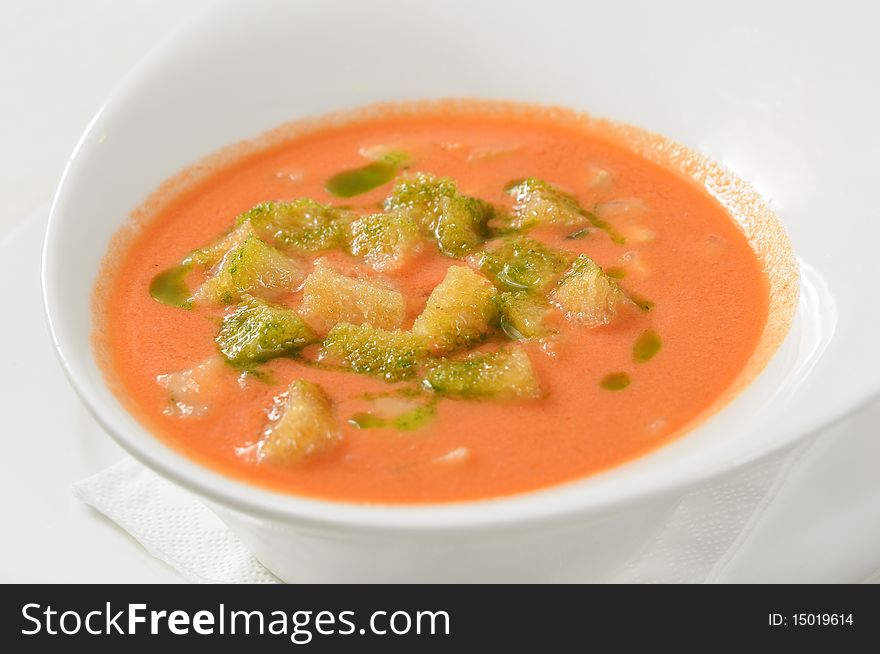 Hot soup on a red table