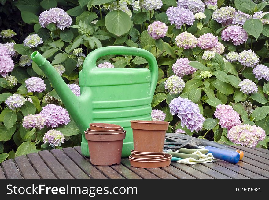 Old used gardening tools in a garden on a table