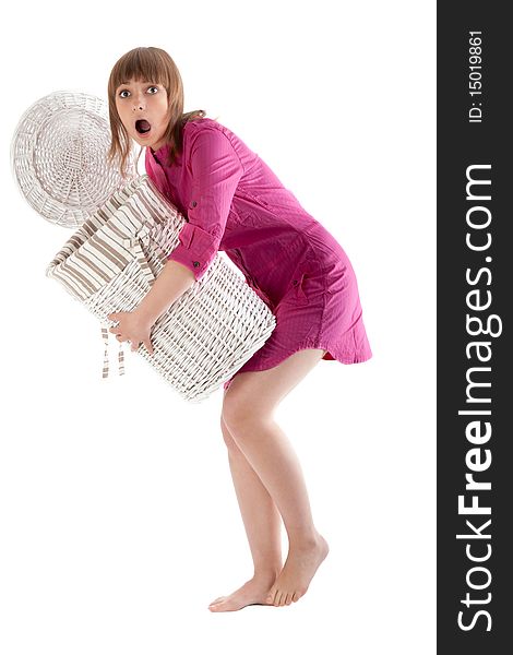 Beautiful girl wonders with basket for linen