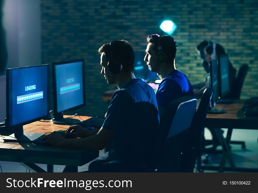 Young people playing video games at tournament