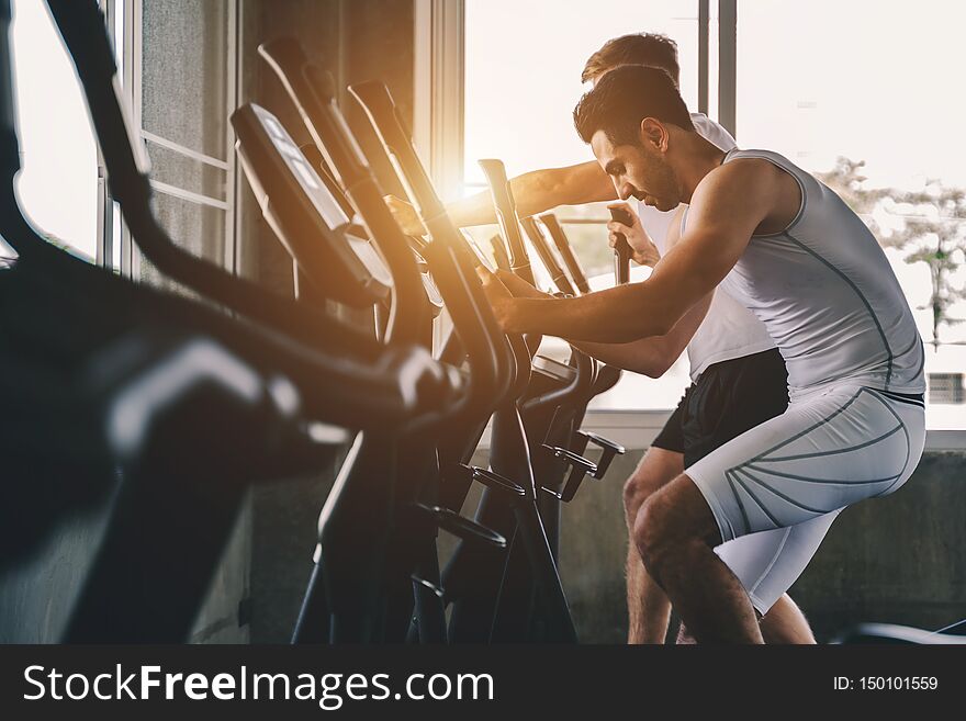 Group of young people doing exercises in gym ,fitness concept