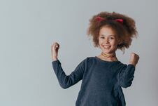 Headshot Portrait Of Happy Girl With Curly Hair Smiling Looking At Camera. Royalty Free Stock Photography Headshot Portrait Of Happy Girl With Curly Hair Smiling Looking At Camera. Royalty Free Stock Photography