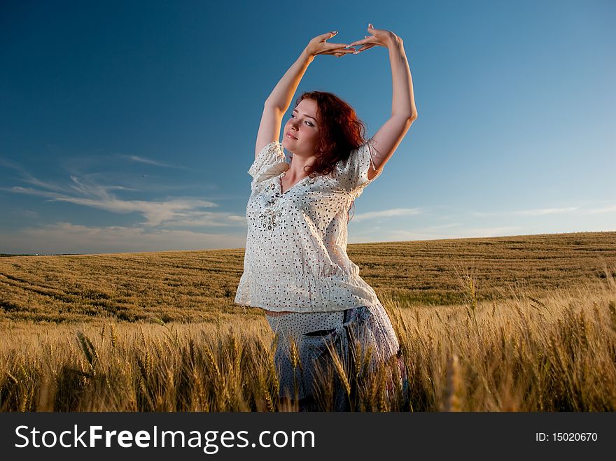 Young woman at wheat