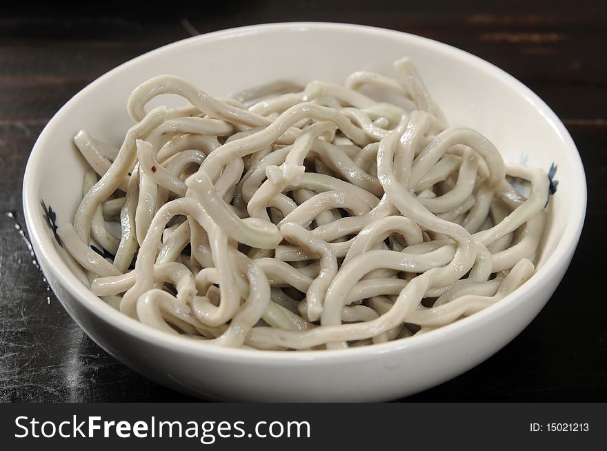 Udon noodles on the white table