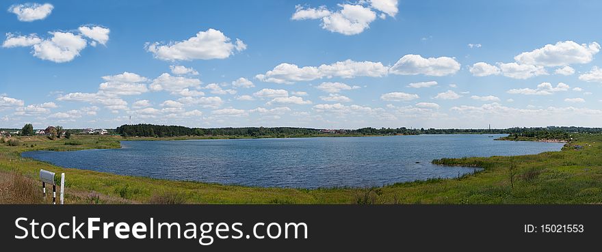 Panoramic lake the sky and clouds. Panoramic lake the sky and clouds